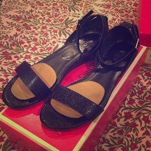 Used black snakeskin also low back platform